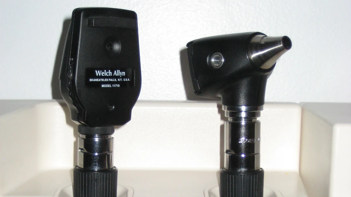 An otoscope for examining the ear beside an ophthalmoscope