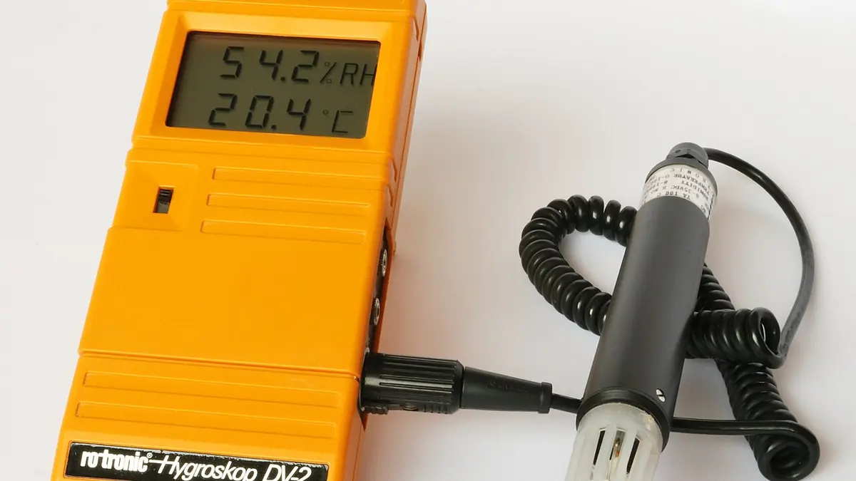An electronic thermohygrometer displaying relative humidity and temperature