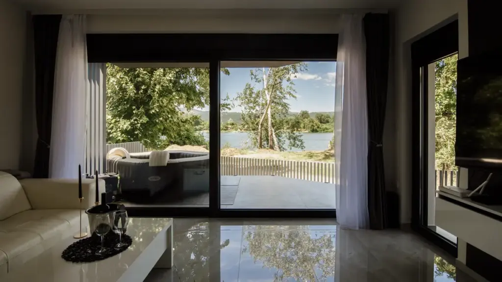 A spacious modern living room with large windows