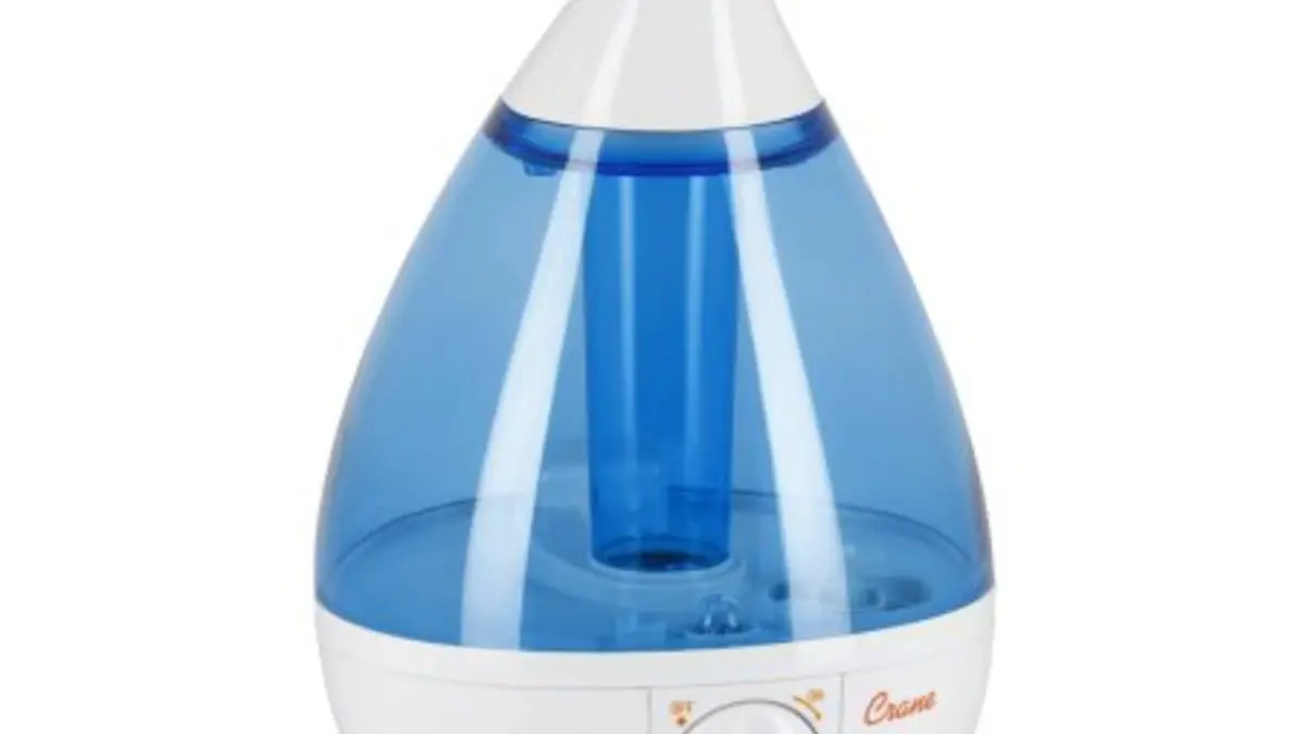 An ultrasonic cool-mist humidifier operating on a table