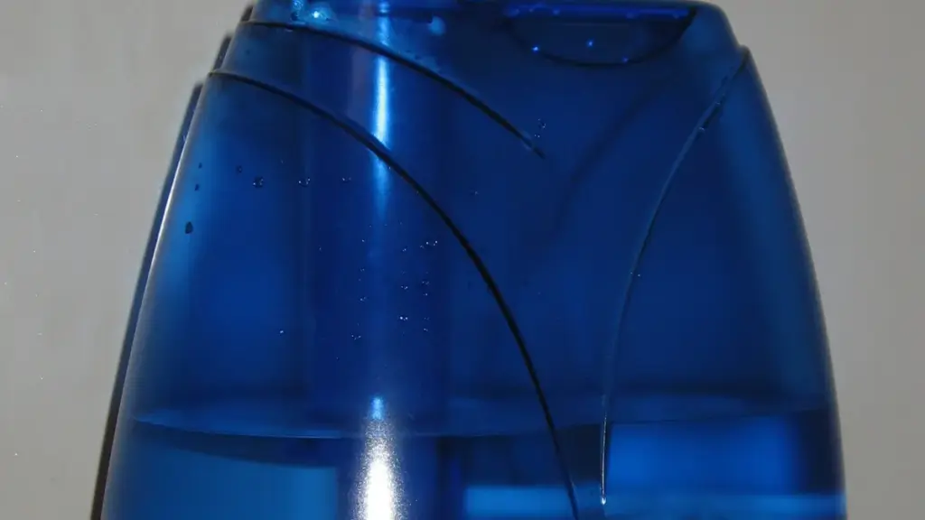 A blue ultrasonic humidifier on a white surface