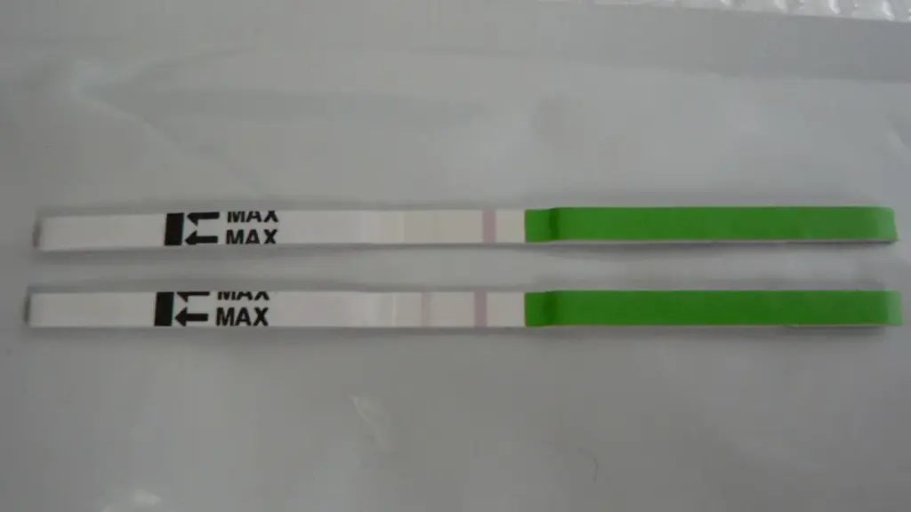 Two urine-based LH ovulation test strips, illustrating fertility tracking rather than a claim about oils