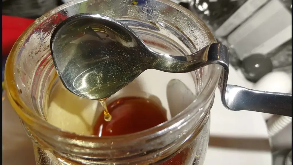 Honey on a spoon, a soothing option discussed for coughs in people over one year old