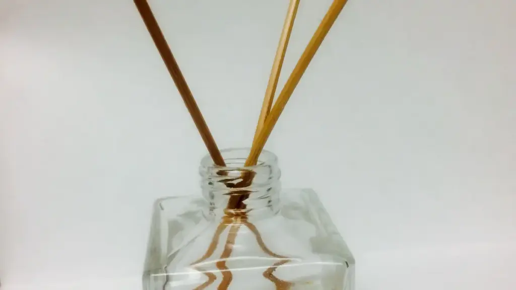 A glass reed diffuser containing lavender essential oil