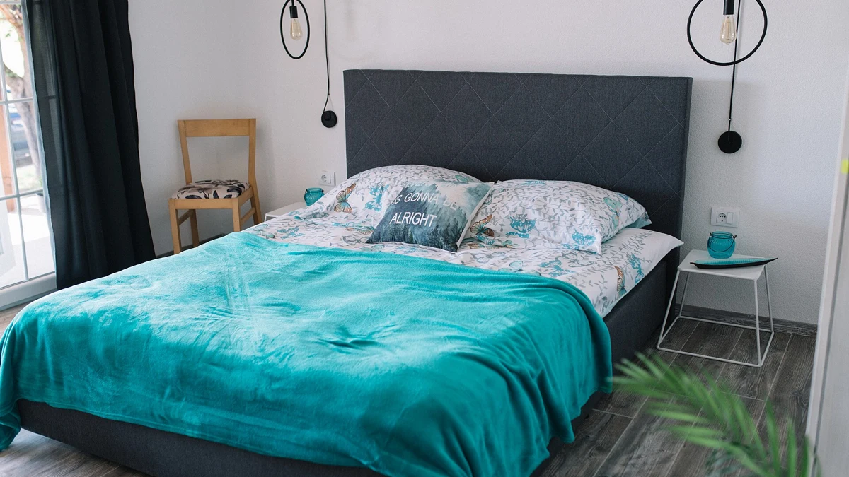 A made bed with pillows in a bedroom